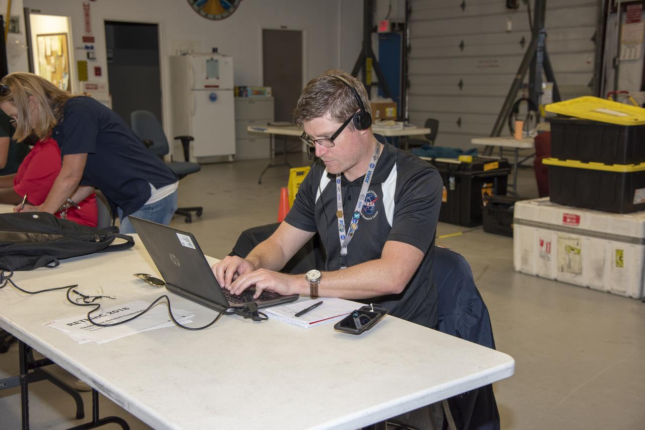 NASA mission controllers, engineers, pilots and communications specialists in the mission control room monitor the supersonic research flight off the coast of Galveston, as part of the QSF18 flight series. The flight operations crew tracks the status of the flights, maintains communications with the aircraft, communicates with U.S. Coast Guard, and coordinates community feedback data.