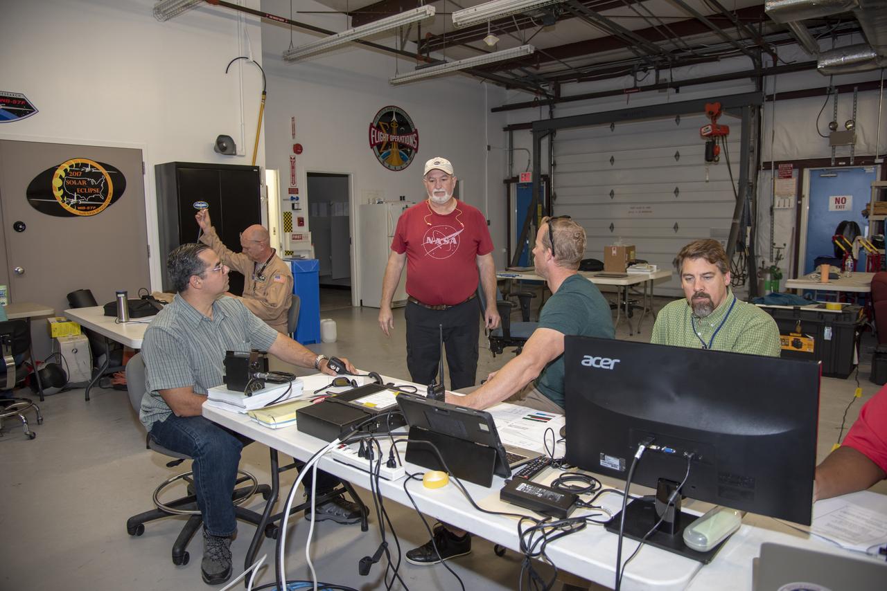 NASA mission controllers, engineers, pilots and communications specialists in the mission control room monitor the supersonic research flight off the coast of Galveston, as part of the QSF18 flight series. The flight operations crew tracks the status of the flights, maintains communications with the aircraft, communicates with U.S. Coast Guard, and coordinates community feedback data.