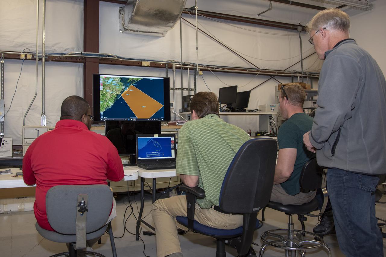 NASA mission controllers, engineers, pilots and communications specialists in the mission control room monitor the supersonic research flight off the coast of Galveston, as part of the QSF18 flight series. The flight operations crew tracks the status of the flights, maintains communications with the aircraft, communicates with U.S. Coast Guard, and coordinates community feedback data.
