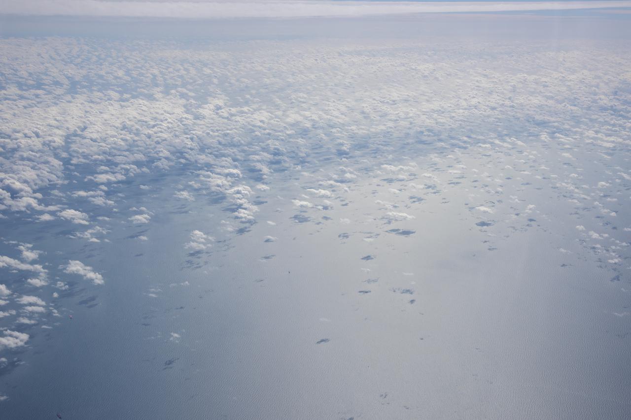 The Gulf of Mexico as seen from NASA photographer Carla Thomas at high altitude in the F/A-18 research aircraft during a flight in support of the Quiet Supersonic Flights 2018 series, or QSF18. The high altitude is necessary as part of the quiet supersonic dive maneuver, climbing to around 50,000 feet, followed by a supersonic, inverted dive. This creates sonic boom shockwaves in a way that they are quieter in a specific area.