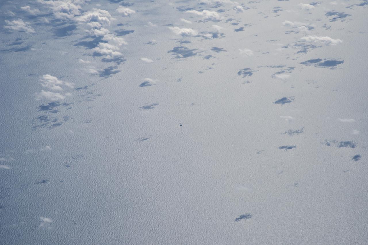 The Gulf of Mexico as seen from NASA photographer Carla Thomas at high altitude in the F/A-18 research aircraft during a flight in support of the Quiet Supersonic Flights 2018 series, or QSF18. The high altitude is necessary as part of the quiet supersonic dive maneuver, climbing to around 50,000 feet, followed by a supersonic, inverted dive. This creates sonic boom shockwaves in a way that they are quieter in a specific area.