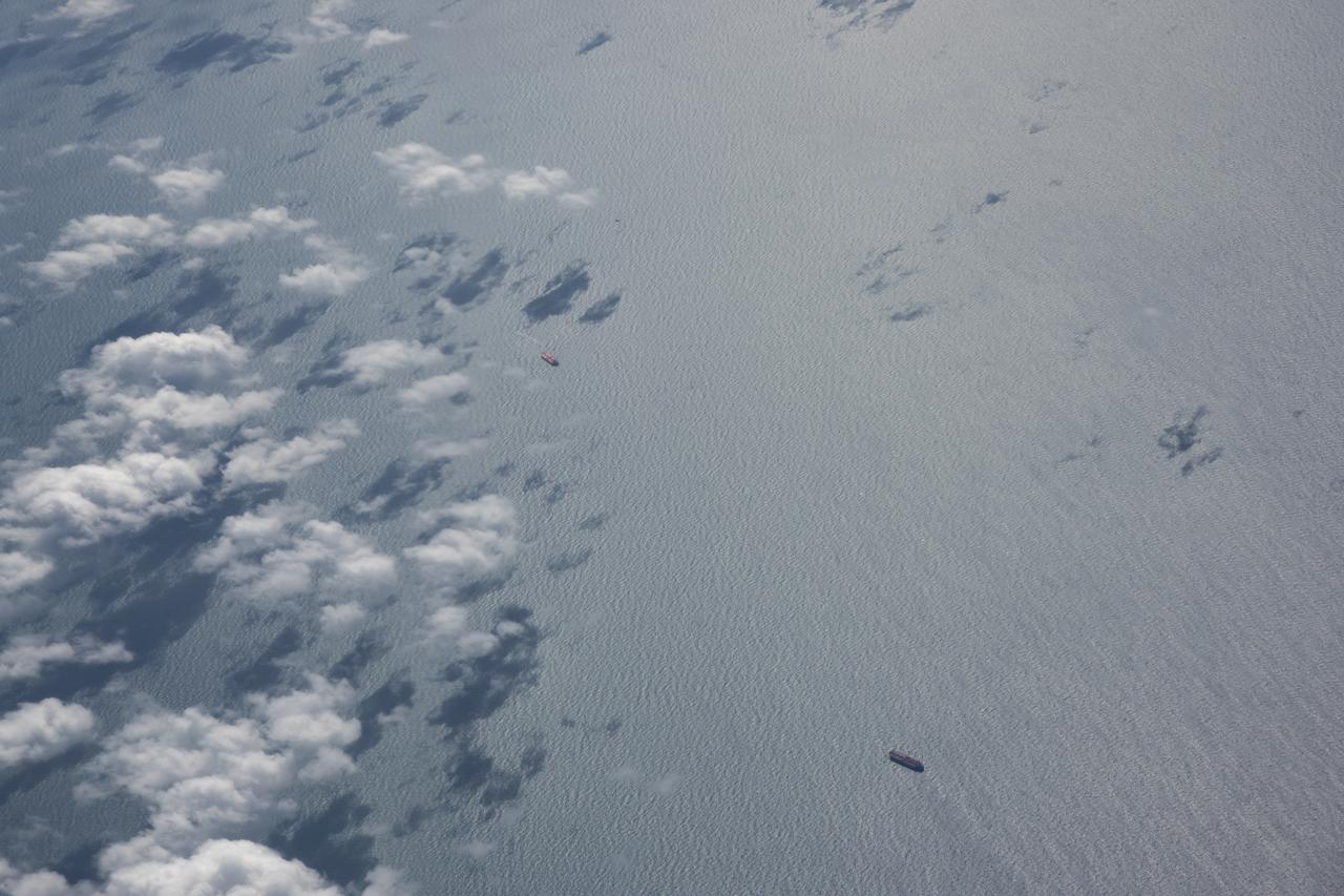 The Gulf of Mexico as seen from NASA photographer Carla Thomas at high altitude in the F/A-18 research aircraft during a flight in support of the Quiet Supersonic Flights 2018 series, or QSF18. The high altitude is necessary as part of the quiet supersonic dive maneuver, climbing to around 50,000 feet, followed by a supersonic, inverted dive. This creates sonic boom shockwaves in a way that they are quieter in a specific area.
