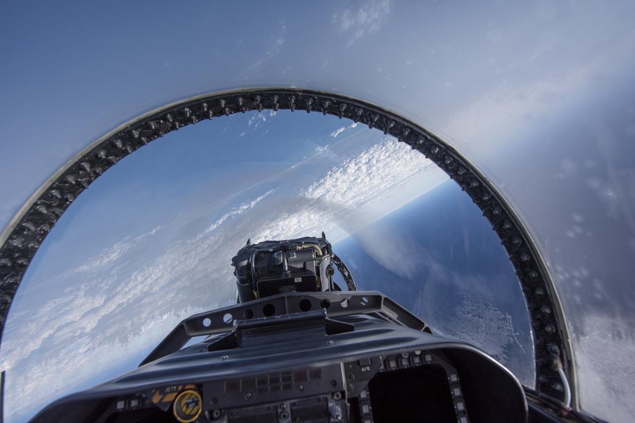 NASA test pilots perform the quiet supersonic dive maneuver off the coast of Galveston, Texas to create a quieter version of the sonic boom, in order to obtain recruited community survey feedback data. The test pilot climbs to around 50,000 feet, followed by a supersonic, inverted dive. This creates sonic boom shockwaves in a way that they are quieter in a specific area. Meanwhile, NASA researchers match community feedback to the sound levels of the flights, using an electronic survey and microphone monitor stations on the ground. This is preparing NASA for community response models for the future X-59 QueSST.