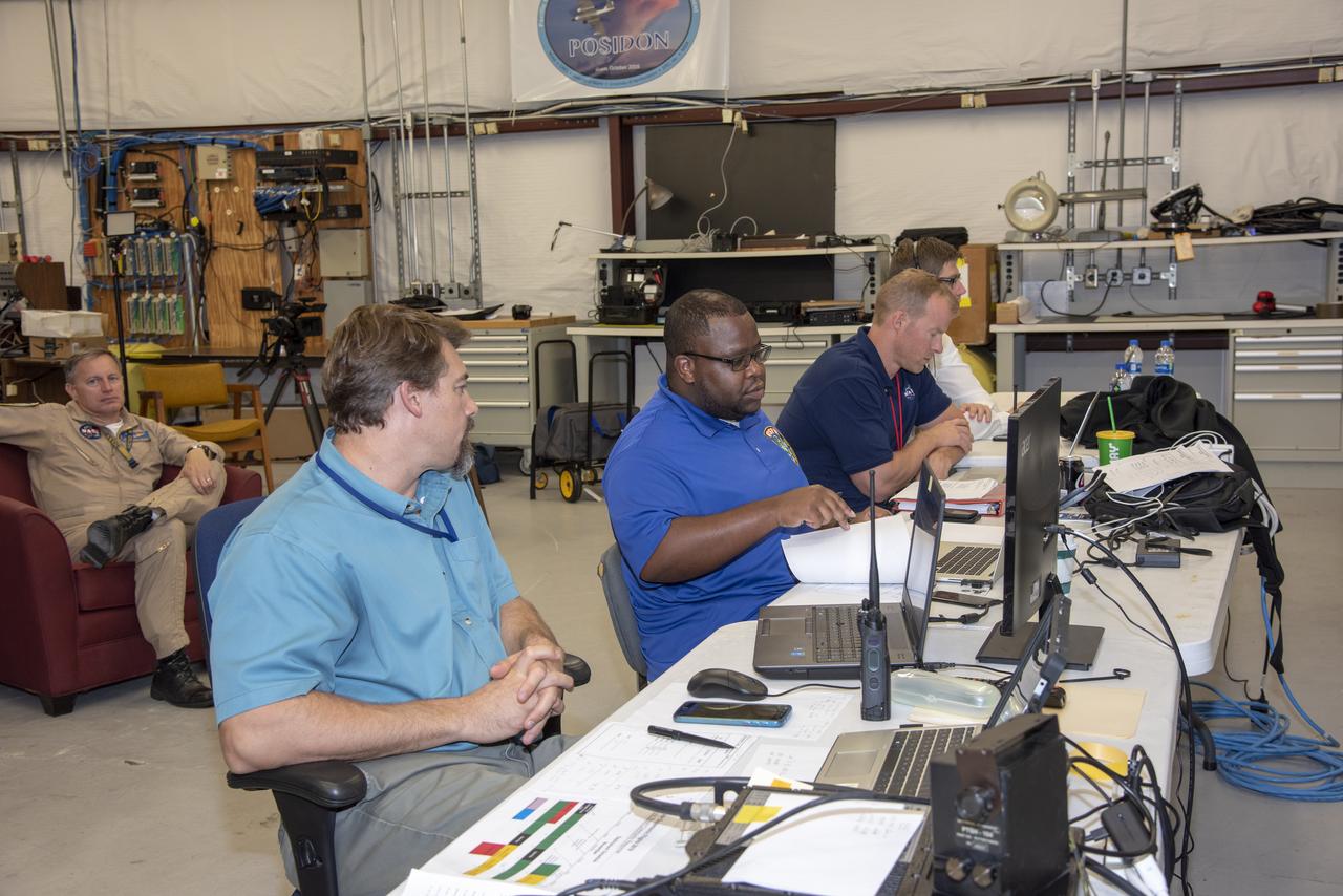 NASA mission controllers, engineers, pilots and communications specialists in the mission control room monitor the supersonic research flight off the coast of Galveston, as part of the QSF18 flight series. The flight operations crew tracks the status of the flights, maintains communications with the aircraft, communicates with U.S. Coast Guard, and coordinates community feedback data.
