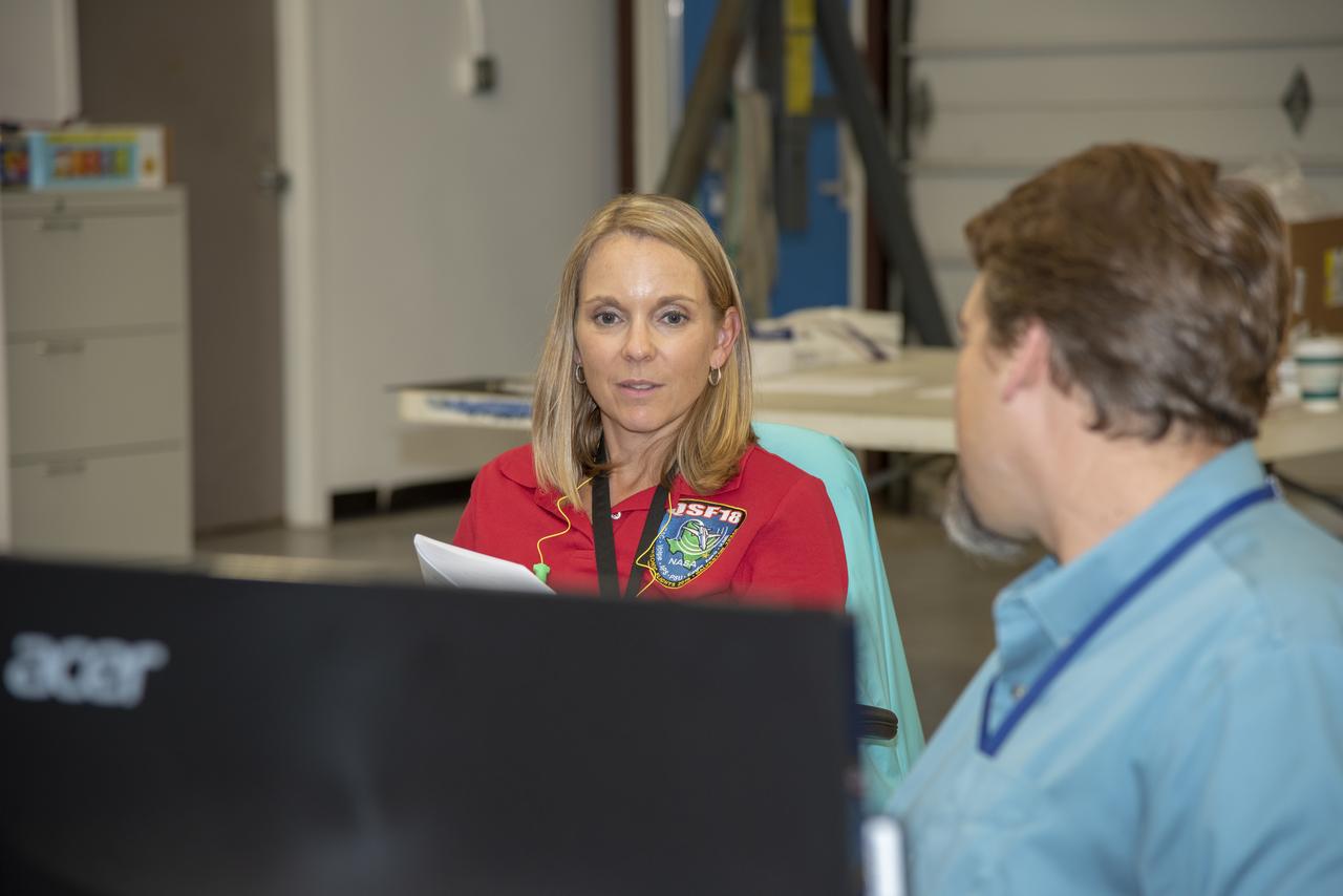 NASA mission controllers, engineers, pilots and communications specialists in the mission control room monitor the supersonic research flight off the coast of Galveston, as part of the QSF18 flight series. The flight operations crew tracks the status of the flights, maintains communications with the aircraft, communicates with U.S. Coast Guard, and coordinates community feedback data.