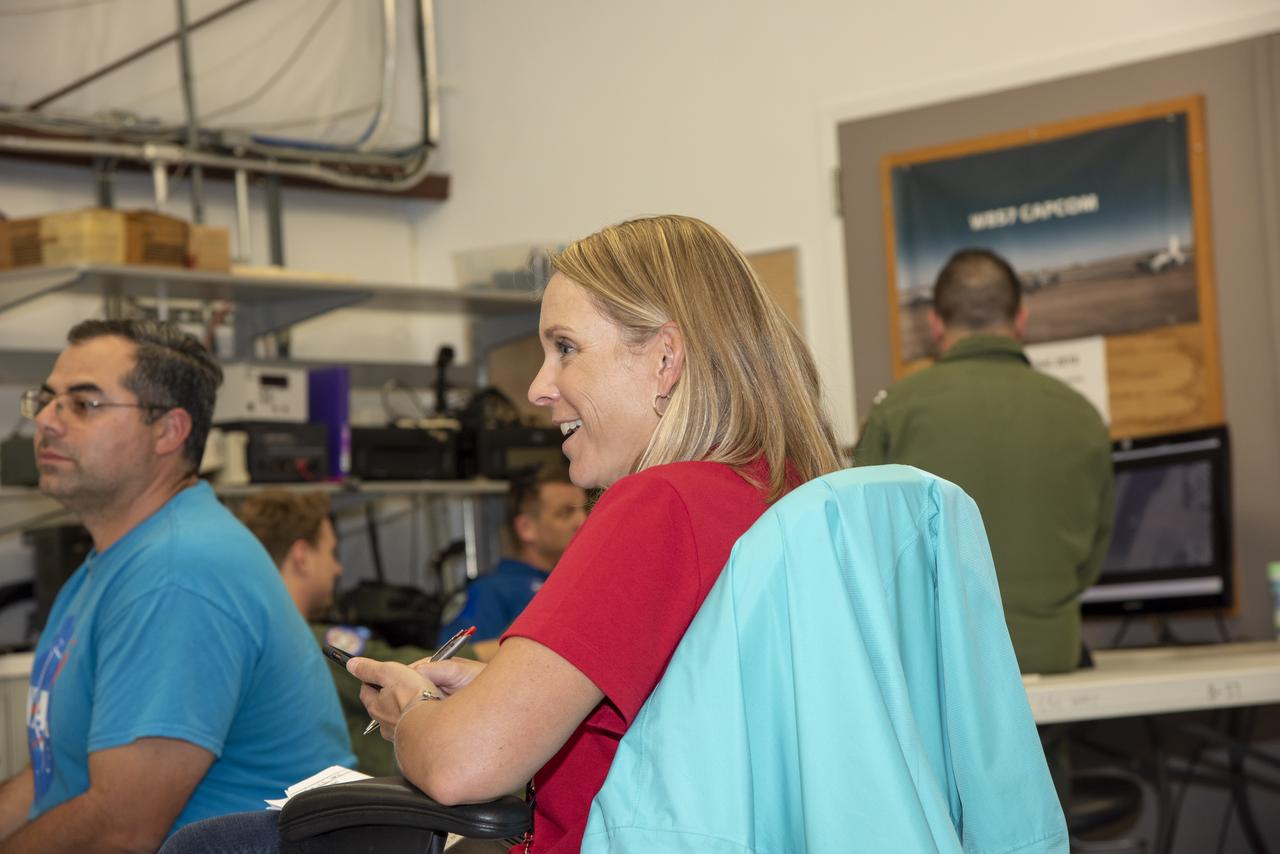 NASA mission controllers, engineers, pilots and communications specialists in the mission control room monitor the supersonic research flight off the coast of Galveston, as part of the QSF18 flight series. The flight operations crew tracks the status of the flights, maintains communications with the aircraft, communicates with U.S. Coast Guard, and coordinates community feedback data.