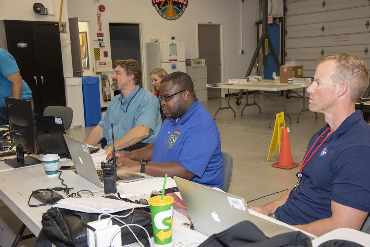 NASA mission controllers, engineers, pilots and communications specialists in the mission control room monitor the supersonic research flight off the coast of Galveston, as part of the QSF18 flight series. The flight operations crew tracks the status of the flights, maintains communications with the aircraft, communicates with U.S. Coast Guard, and coordinates community feedback data.