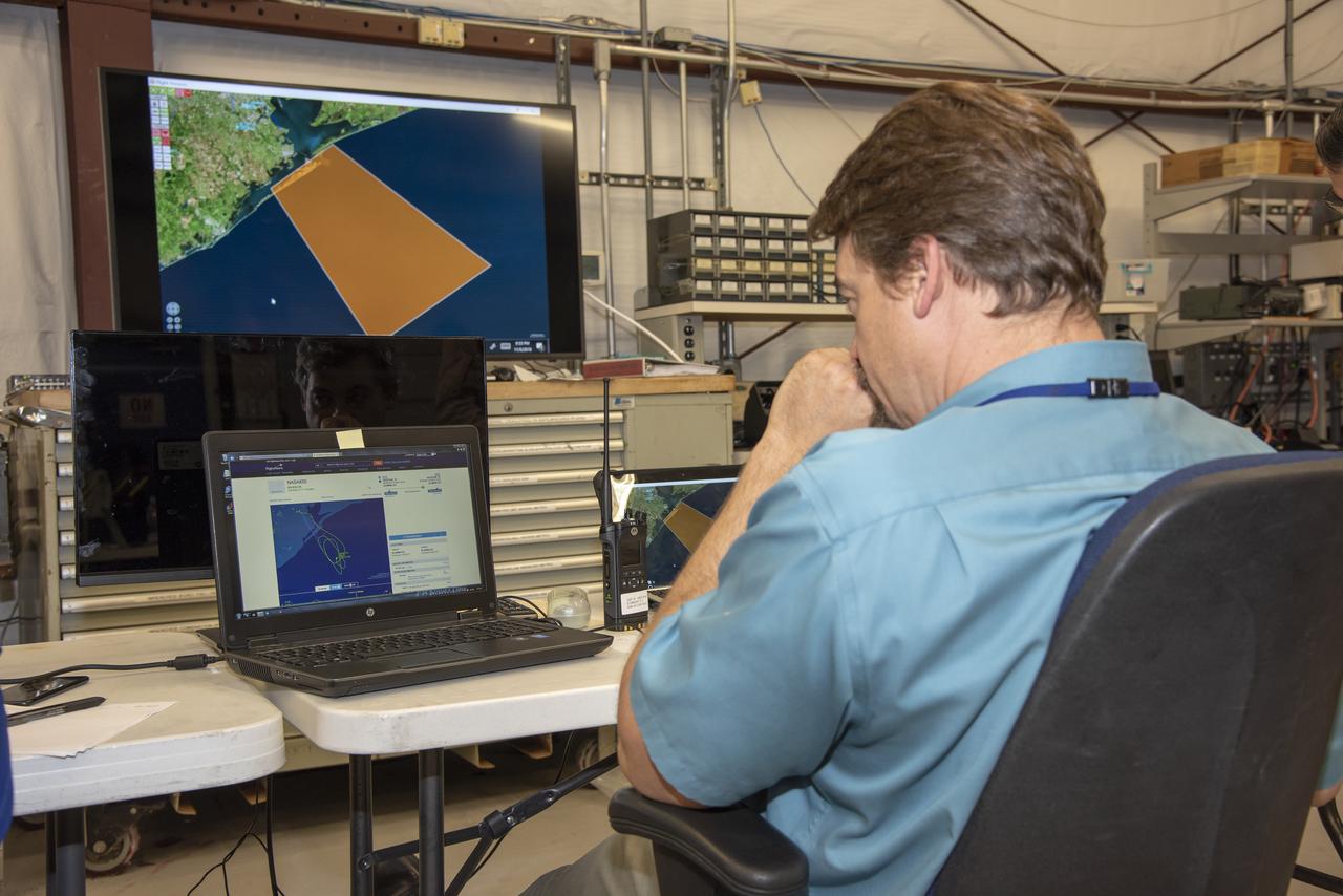 NASA mission controllers, engineers, pilots and communications specialists in the mission control room monitor the supersonic research flight off the coast of Galveston, as part of the QSF18 flight series. The flight operations crew tracks the status of the flights, maintains communications with the aircraft, communicates with U.S. Coast Guard, and coordinates community feedback data.