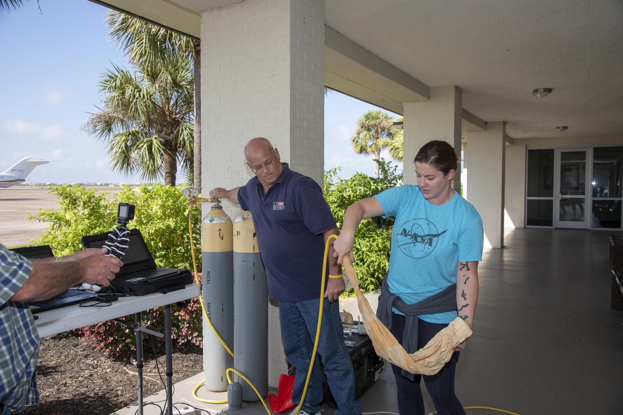 In order to make sure weather conditions are acceptable at multiple altitudes, NASA meteorologists on the ground conduct constant monitoring operations, and launch weather balloons to get accurate data for aircraft and pilot. 