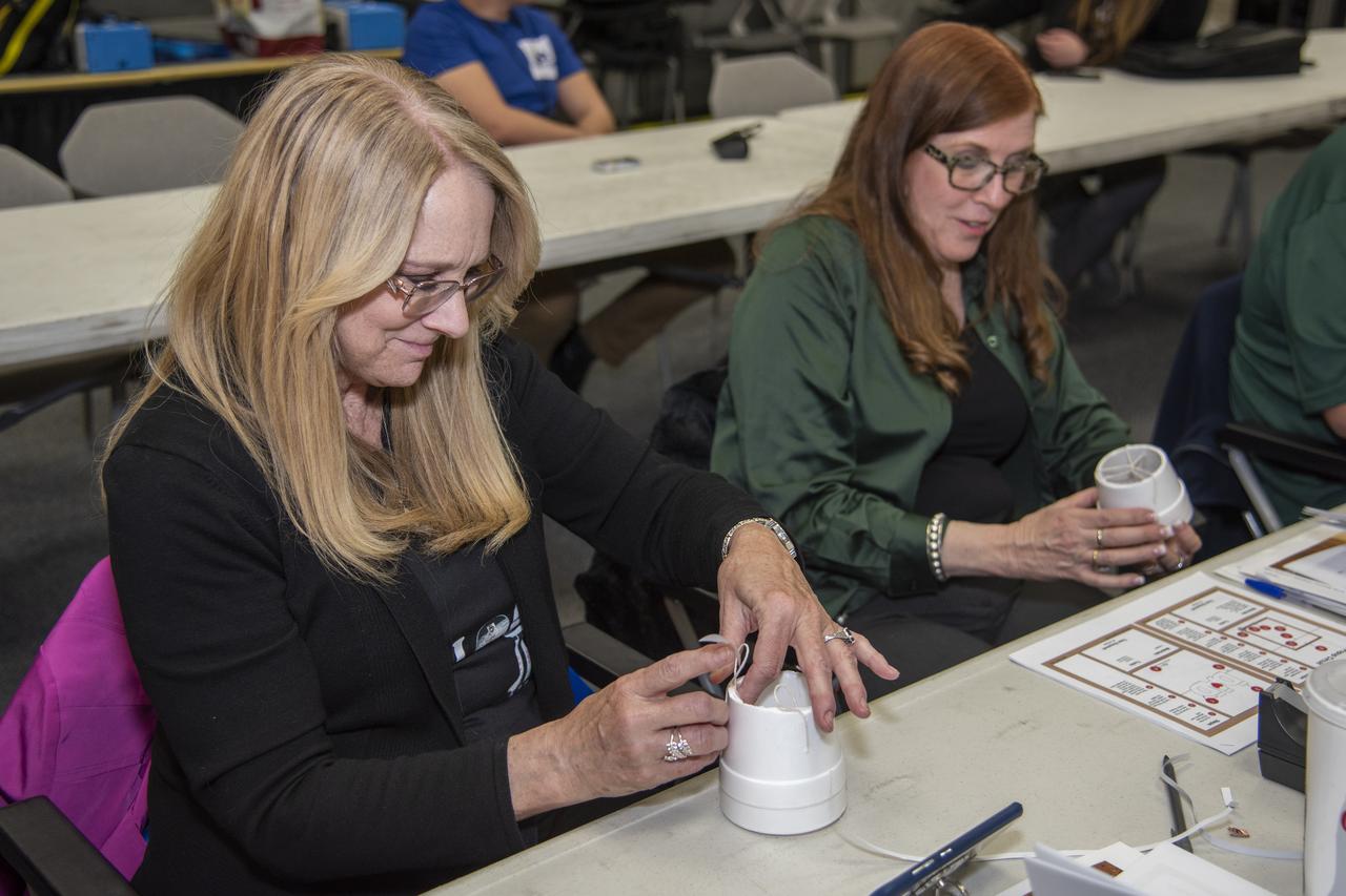 Teacher Kristen Deckner learns how to build a Remote Manipulator (Robotic) Arm during the Educational Technology Institute hosted by NASA Armstrong's Office of STEM Engagement.