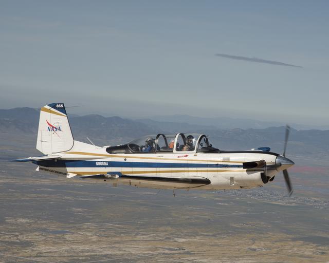 NASA Aircraft heads to Southern California’s Poppy Reserve in the foreground. Rainy Season made the Antelope Valley colorful with poppies and wildflowers.