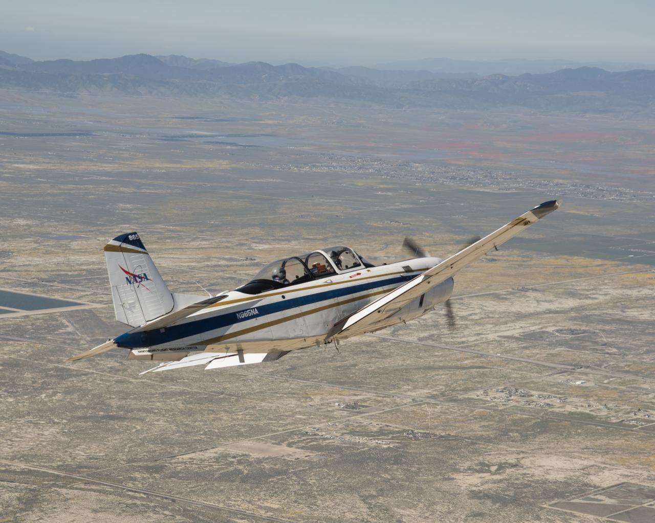 NASA's T-34 aircraft flown from the agency's Armstrong Flight Research Center aims the plane toward Southern California's Antelope Valley Poppy Reserve. The aircraft was flown from the agency's Armstrong Flight Research Center.