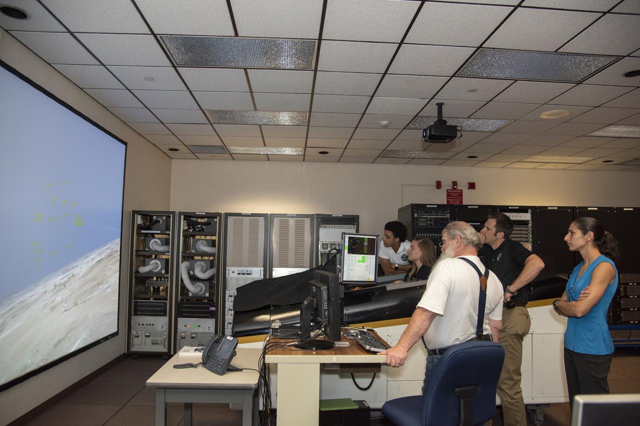 NASA’s 2017 astronaut candidates (L to R) Jessica Watkins, Jenni Sidey-Gibbons, Joshua Kutryk, and Jasmin Moghbeli practice flying in an F-18 aircraft cockpit simulator at Armstrong Flight Research Center, in Southern California. The F-18’s are flown for research support and pilot proficiency. Currently, the F-18’s are being used to conduct supersonic research in support of the X-59 QueSST overall mission.