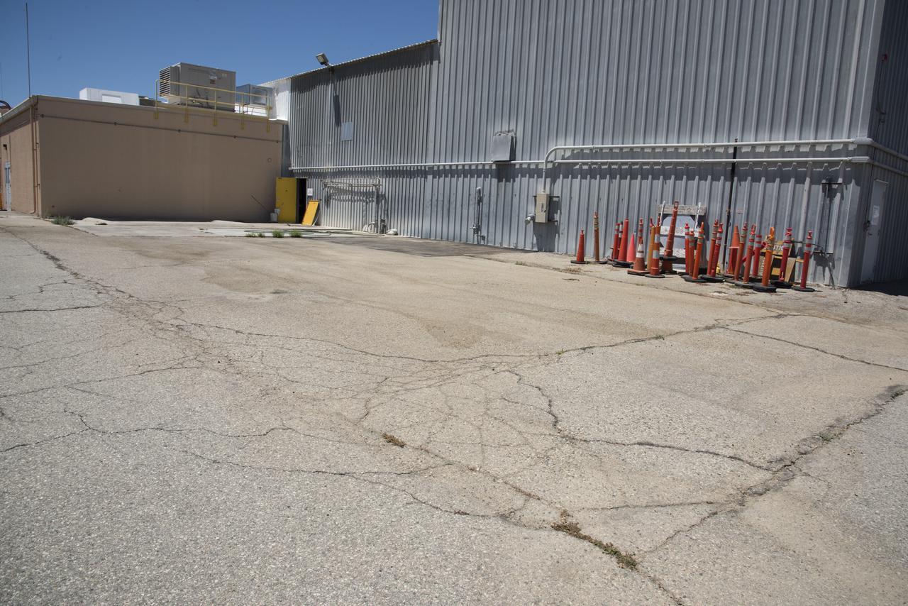 On the east side of Building 4826, the future home of the X-59 Quiet SuperSonic Technology aircraft, a conference room, offices, restrooms and a communications room are under construction at NASA's Armstrong Flight Research Center in Edwards, California.