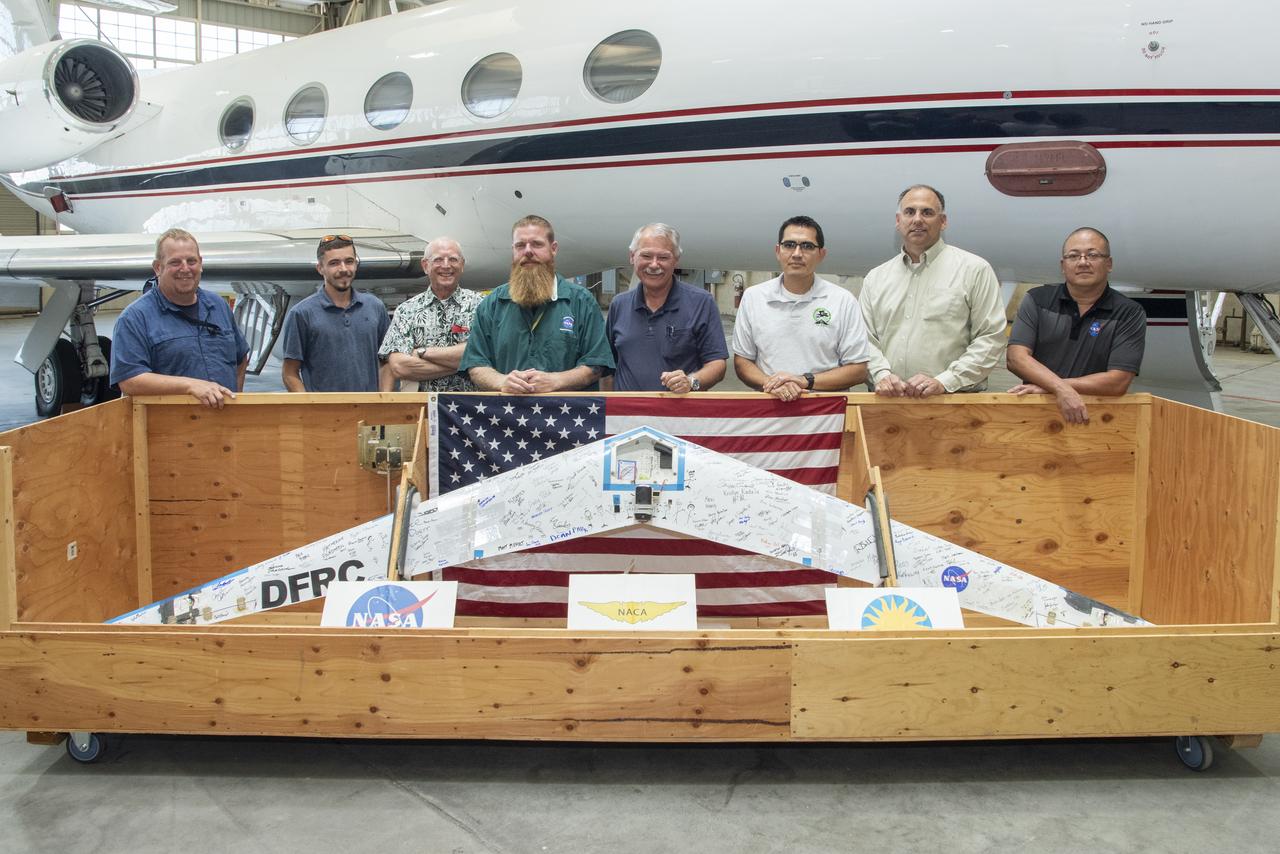 Preliminary Research Aerodynamic Design to Lower Drag, or Prandtl-D1, will be displayed in an upcoming Innovations Gallery at the National Air and Space Museum, the Smithsonian Institute. The aircraft, which flew from NASA's Armstrong Flight Research Center in California, uses a method of aircraft design that introduces a twist that results in a more efficient wing. From left are Robert "Red" Jensen, Logan Shaw, Christian Gelzer, Justin Hall, Al Bowers, Oscar Murillo, Brian Eslinger and Derek Abramson