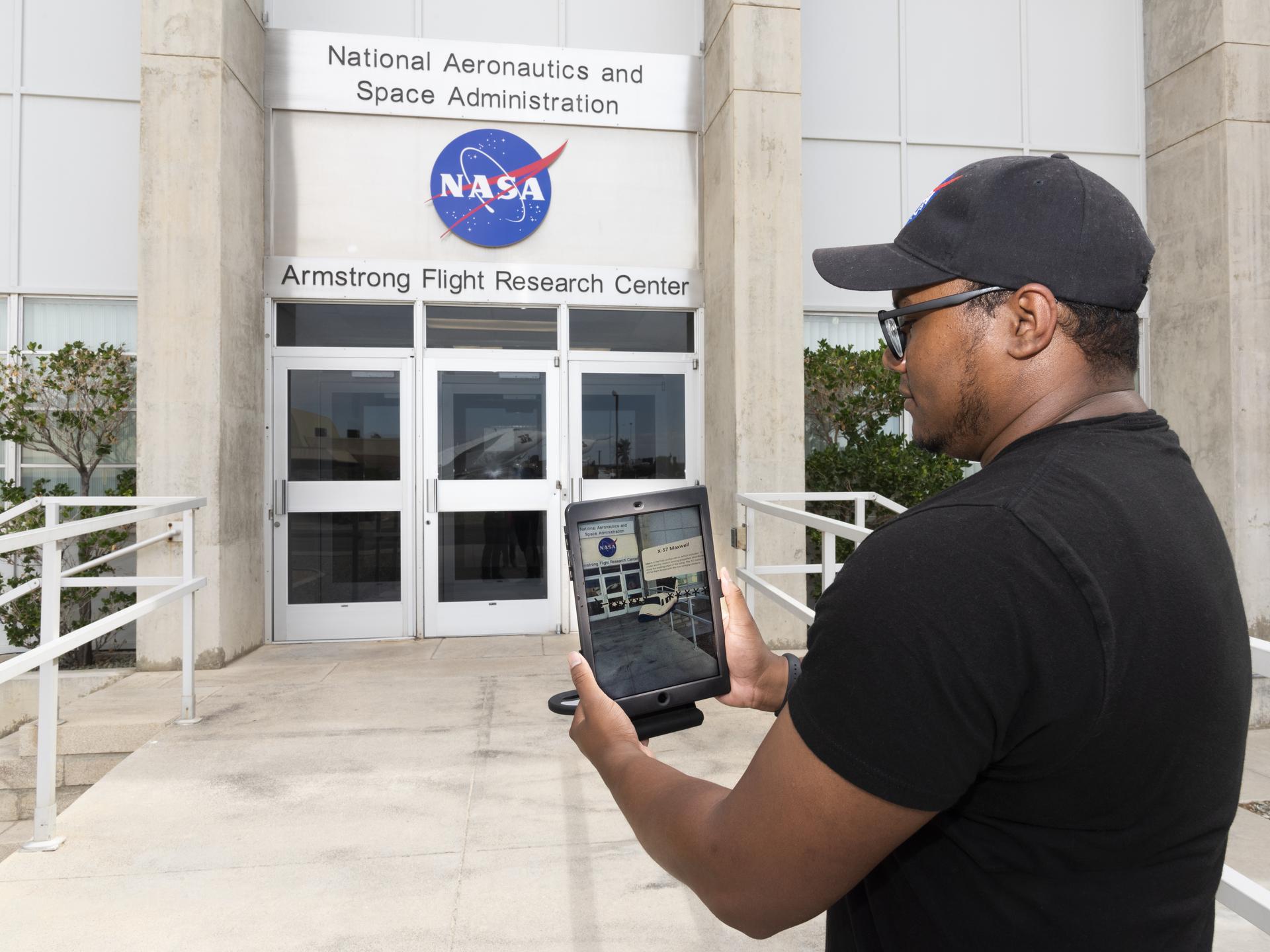 Daniel Williams, intern, shows what the app looks like while in use with the 3D model of the X-57 Maxwell displayed.
