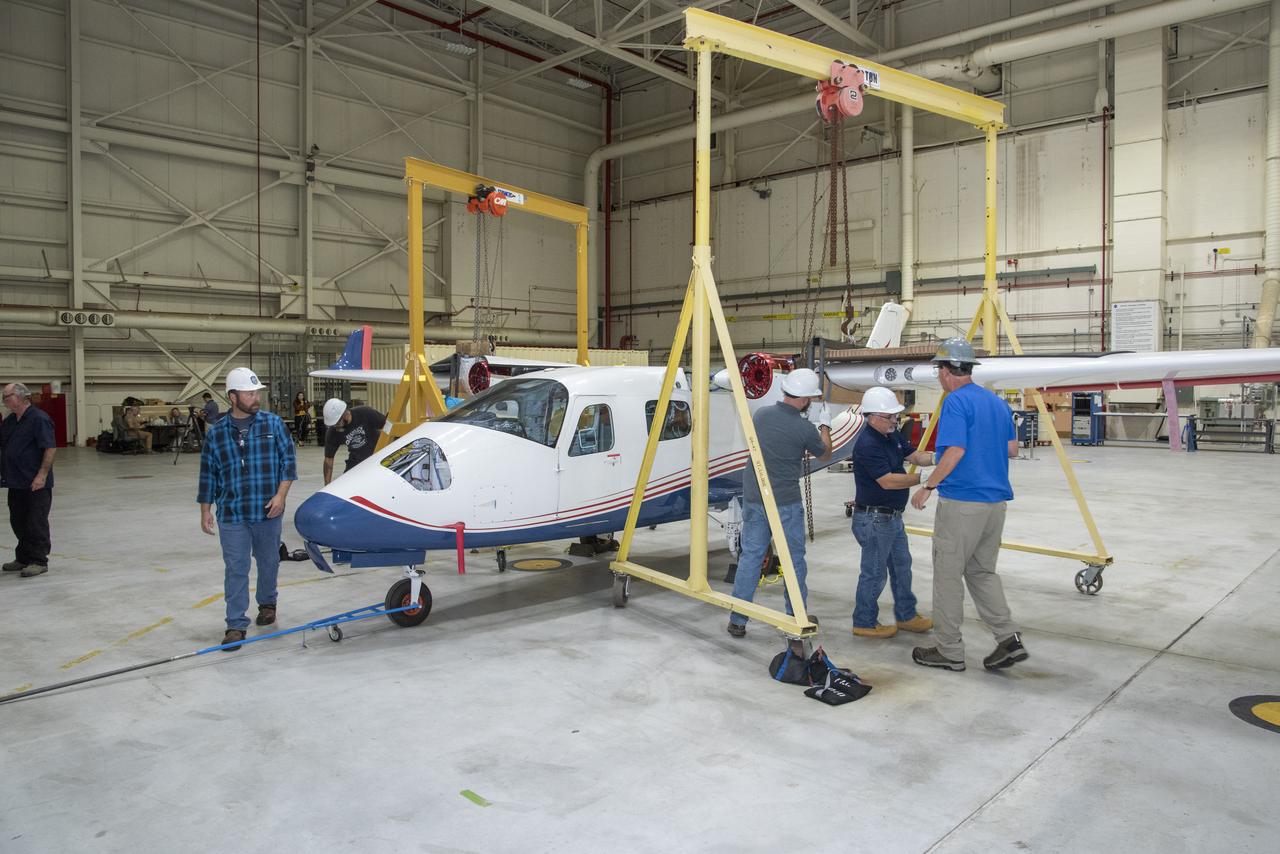 The X-57 Mod II wing is rejoined with the aircraft's fuselage to begin preparations for reintegration at NASA's Armstrong Flight Research Center in California. X-57's Mod II configuration, the first of three primary modifications for the project, involves testing of the aircraft's cruise electric propulsion system.