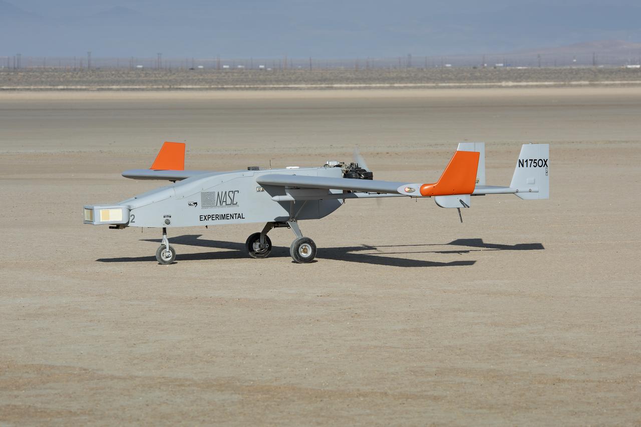 The Navmar Applied Sciences Corporation’s TigerShark sits on the lakebed at Edwards Air Force Base after completing a flight for the Unmanned Aircraft Systems integration in the National Airspace Systems, Flight Test Series Six (FT6) project. FT6 took place at NASA’s Armstrong Flight Research Center in California and focused on low size weight and power sensors for Detect and Avoid (DAA) operations in controlled airspace to inform the FAA through the RTCA Special Committee DAA Working Group on the phase 2 minimum operational performance standards for DAA and air-to-air radar.