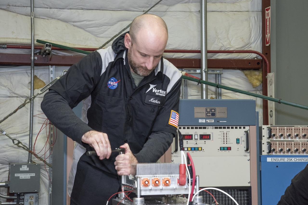 Engineers from NASA's Armstrong Flight Research Center and Empirical Systems Aerospace prepare a cruise motor controller, planned to be used on NASA's all-electric X-57 Maxwell, for vibration testing at Armstrong's environmental lab. Testing the cruise motor controller at various vibration levels, based on baseline flight testing in the project's first phase, helps ensure that the hardware will withstand similar vibration in flight conditions. X-57, NASA's first all-electric experimental aircraft, or X-plane, will fly in its first all-electric configuration in 2020.