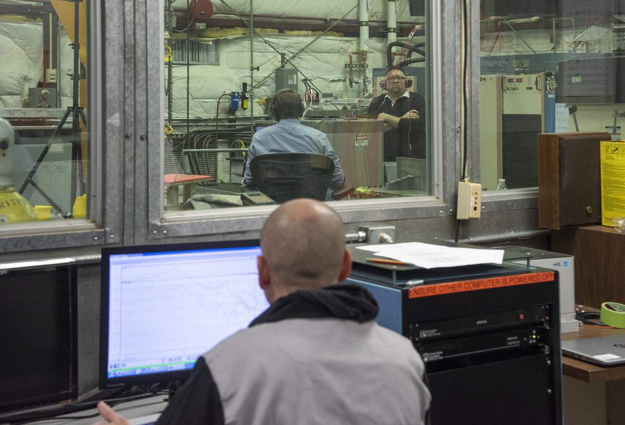 Engineers monitor data during vibration testing of a cruise motor controller for the X-57 Maxwell, NASA's first all-electric X-plane. Attached to a table at NASA Armstrong Flight Research Center's environmental lab, the cruise motor controller is exposed to specific levels of vibration, allowing NASA to examine the structural integrity of the hardware. Engineers, meanwhile, monitored data, including waveforms of electrical current, and recorded readings.