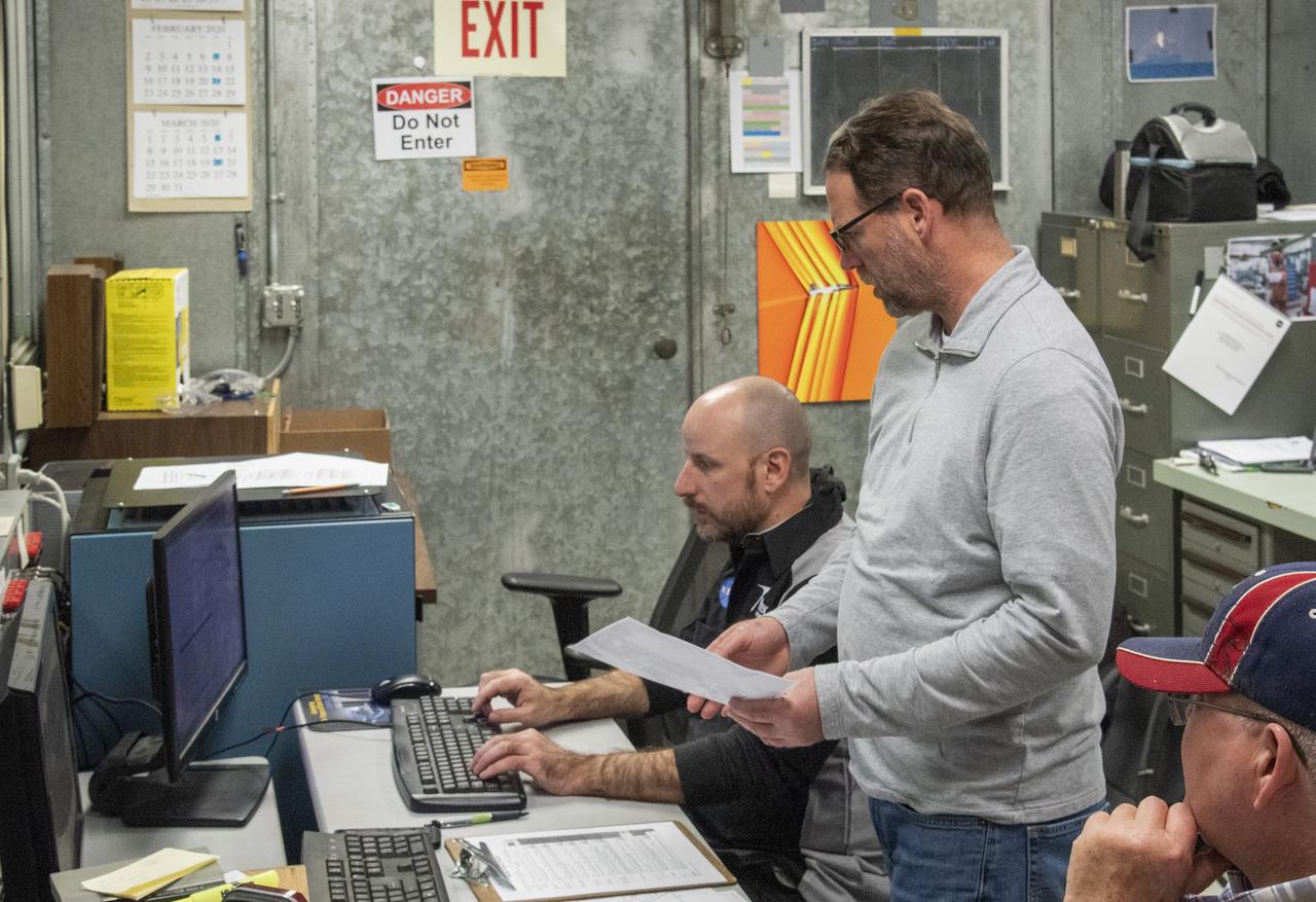 Engineers monitor data during vibration testing of a cruise motor controller for the X-57 Maxwell, NASA's first all-electric X-plane. Attached to a table at NASA Armstrong Flight Research Center's environmental lab, the cruise motor controller is exposed to specific levels of vibration, allowing NASA to examine the structural integrity of the hardware. Engineers, meanwhile, monitored data, including waveforms of electrical current, and recorded readings.