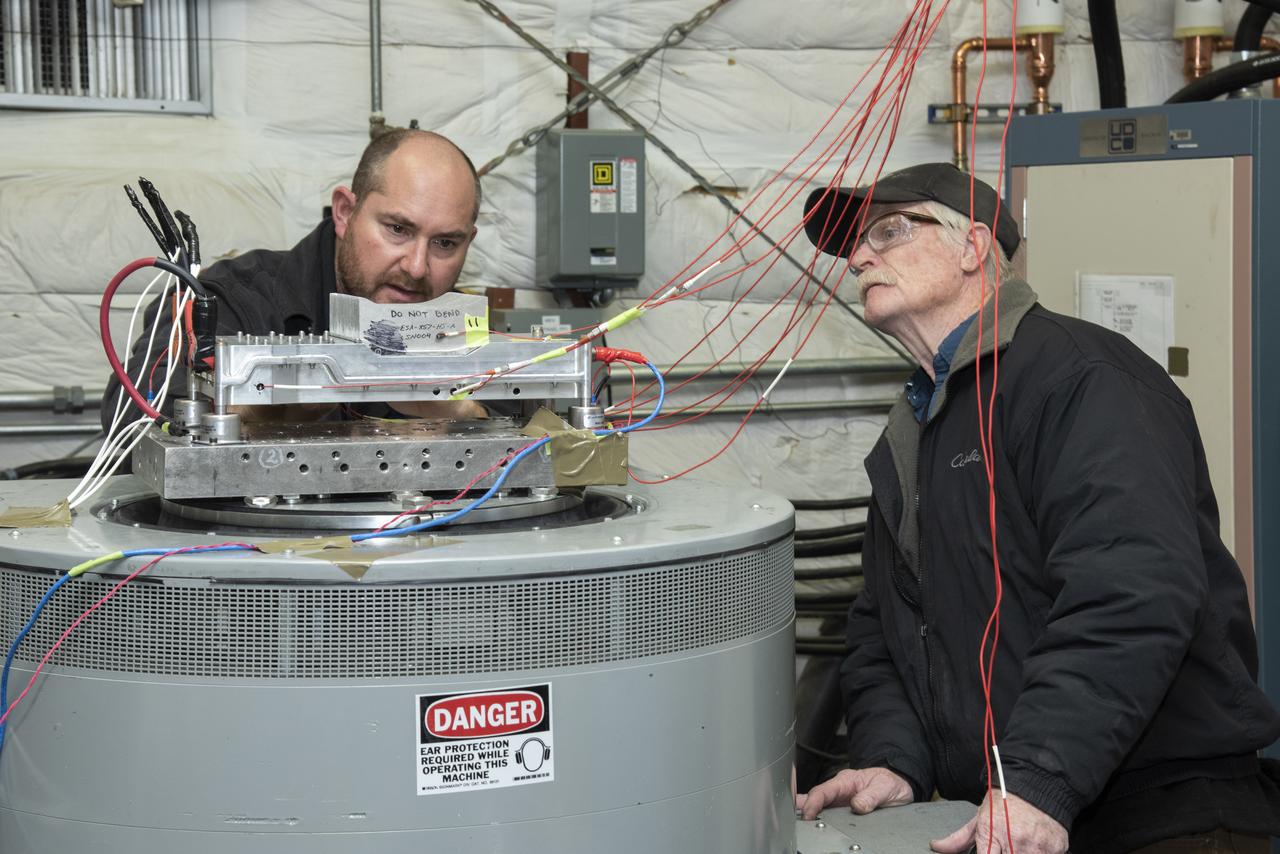 Engineers from NASA's Armstrong Flight Research Center and Empirical Systems Aerospace prepare a cruise motor controller, planned to be used on NASA's all-electric X-57 Maxwell, for vibration testing at Armstrong's environmental lab. Testing the cruise motor controller at various vibration levels, based on baseline flight testing in the project's first phase, helps ensure that the hardware will withstand similar vibration in flight conditions. X-57, NASAs first all-electric experimental aircraft, or X-plane, will fly in its first all-electric configuration in 2020.