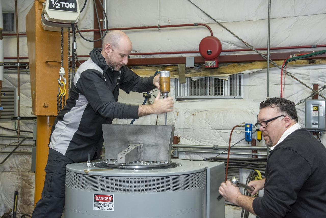 Engineers from NASA's Armstrong Flight Research Center and Empirical Systems Aerospace prepare a cruise motor controller, planned to be used on NASA's all-electric X-57 Maxwell, for vibration testing at Armstrong's environmental lab. Testing the cruise motor controller at various vibration levels, based on baseline flight testing in the project's first phase, helps ensure that the hardware will withstand similar vibration in flight conditions. X-57, NASA's first all-electric experimental aircraft, or X-plane, will fly in its first all-electric configuration in 2020.