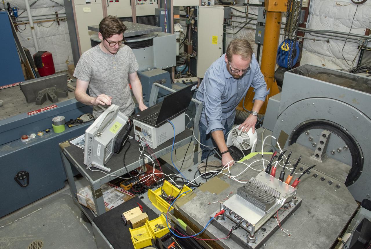 Engineers from NASA’s Armstrong Flight Research Center and Empirical Systems Aerospace prepare a cruise motor controller, planned to be used on NASA’s all-electric X-57 Maxwell, for vibration testing at Armstrong’s environmental lab. Testing the cruise motor controller at various vibration levels, based on baseline flight testing in the project’s first phase, helps ensure that the hardware will withstand similar vibration in flight conditions. X-57, NASA’s first all-electric experimental aircraft, or X-plane, will fly in its first all-electric configuration in 2020.