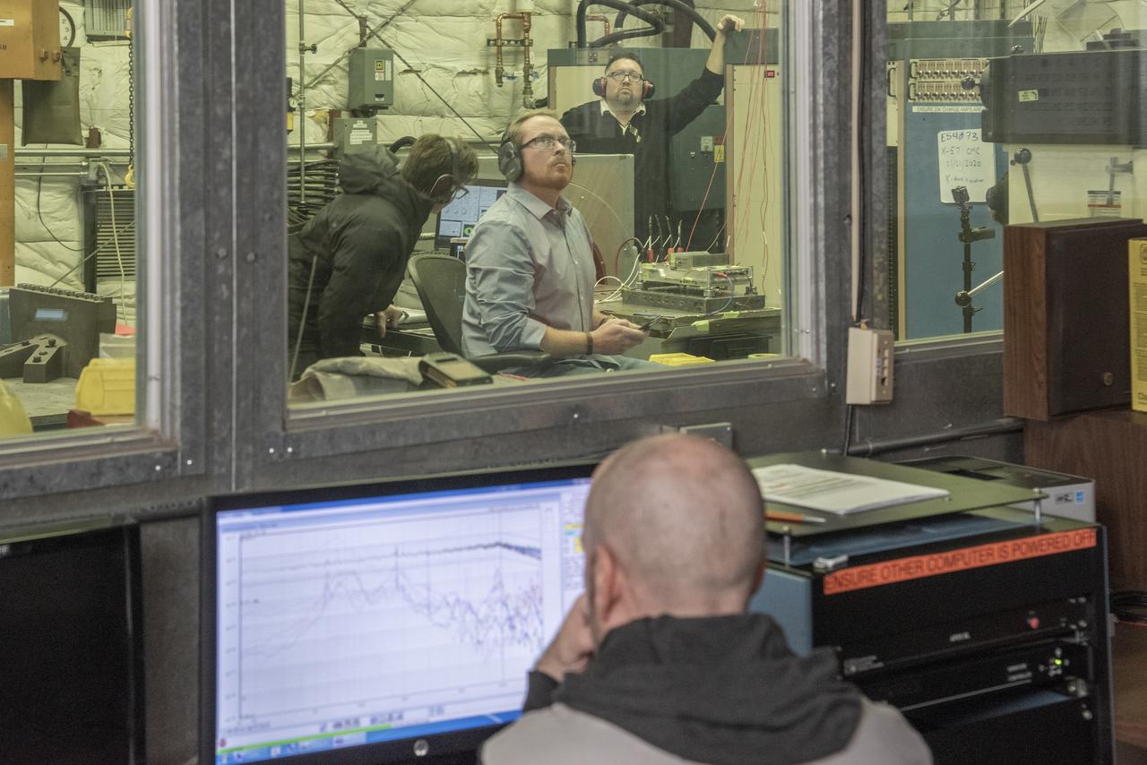 Engineers monitor data during vibration testing of a cruise motor controller for the X-57 Maxwell, NASA’s first all-electric X-plane. Attached to a table at NASA Armstrong Flight Research Center’s environmental lab, the cruise motor controller is exposed to specific levels of vibration, allowing NASA to examine the structural integrity of the hardware. Engineers, meanwhile, monitored data, including waveforms of electrical current, and recorded readings.