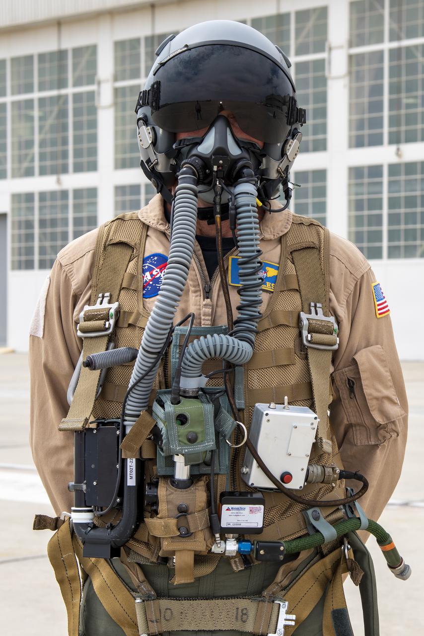 NASA research pilot Jim Less wears a U.S. Navy harness configuration with the NASA Jet Propulsion Laboratory in California prototype mask, which uses laser sensors to determine levels of carbon dioxide and water exhaled inside the mask. This prototype was tested in conjunction with the current VigilOX system, which measures the pilot’s oxygen concentration, breathing pressures and flow rates. This and the U.S. Air Force configuration was used in the Pilot Breathing Assessment program at NASA’s Armstrong Flight Research Center in California.