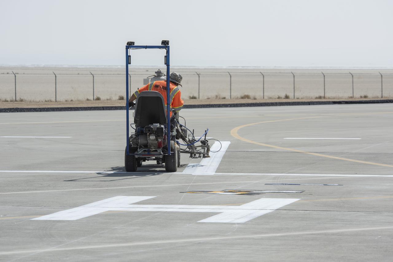 A worker painted vertiports and helipads at NASA's Armstrong Flight Research Center Oct. 6-14, 2020. The Advanced Air Mobility project's National Campaign will use these areas for future flight testing.