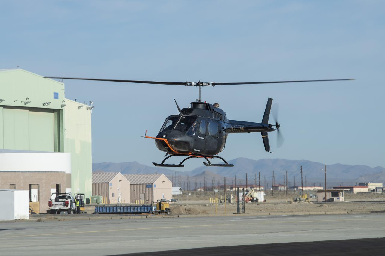A Bell OH-58C Kiowa helicopter provided by Flight Research Inc. in Mojave, California, flies at NASAâ€™s Armstrong Flight Research Center in California the first week of December 2020. The Advanced Air Mobility National Campaign projectÂ used the helicopterÂ as a surrogate urban air mobility vehicle to develop a data baseline for future flight testing.Â Â 