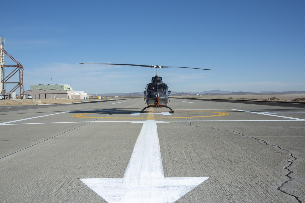 A Bell OH-58C Kiowa helicopter provided by Flight Research Inc. in Mojave, California, sits on a helipad at NASAâ€™s Armstrong Flight Research Center in California the first week of December 2020. The Advanced Air MobilityÂ National Campaign projectÂ used the helicopterÂ as a surrogate urban air mobility vehicle to develop and implement infrastructure, including the markings seen in the image, to support safe operations of these vehicles.Â Â 