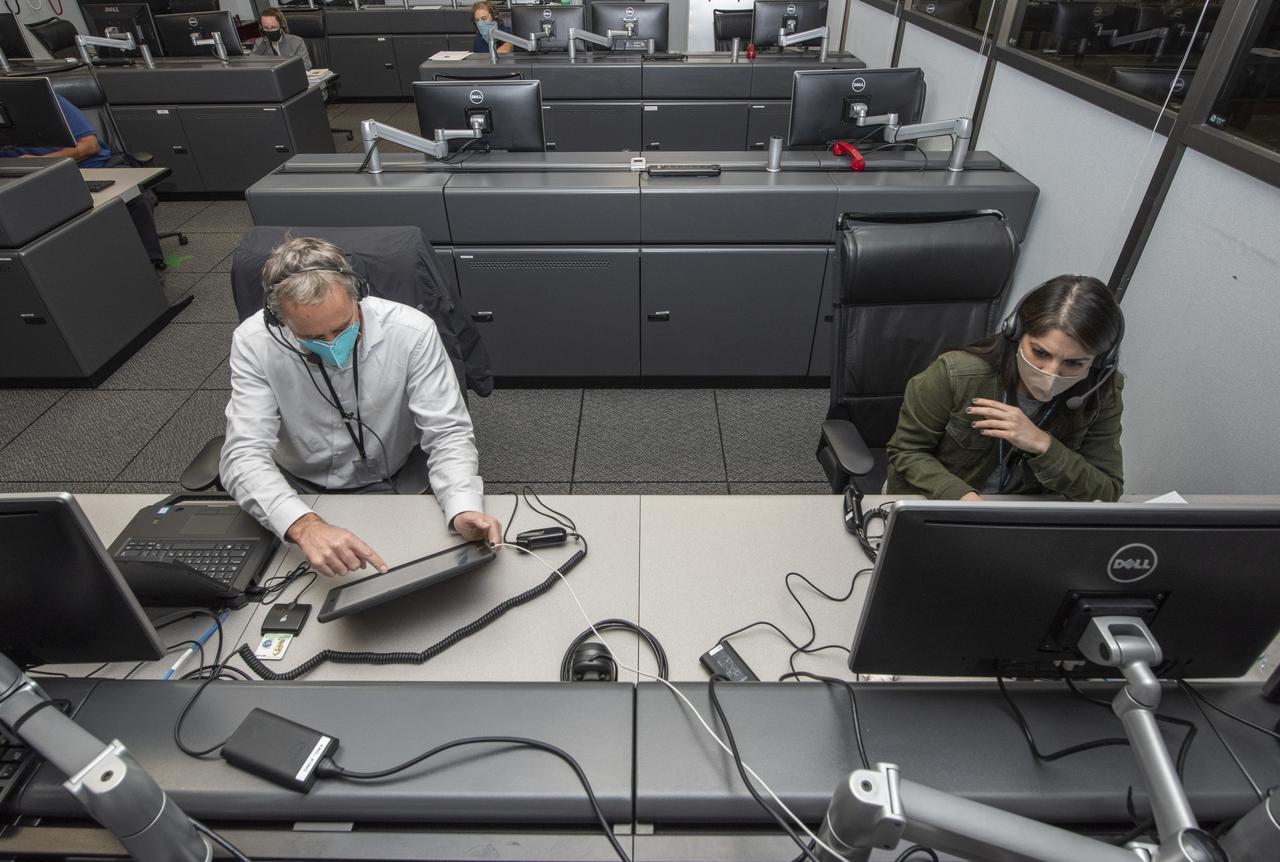 Ames Research Center researchers Yasmin Arbab and Mark Snycerski on the Advanced Air Mobility National Campaign project's Airspace Test Infrastructure (ATI) team monitor surveillance data and connectivity of the flight test infrastructure to a cloud based system in real time during the NC Integrated Dry Run Test team the first week of December 2020 at NASA's Armstrong Flight Research Center in California.