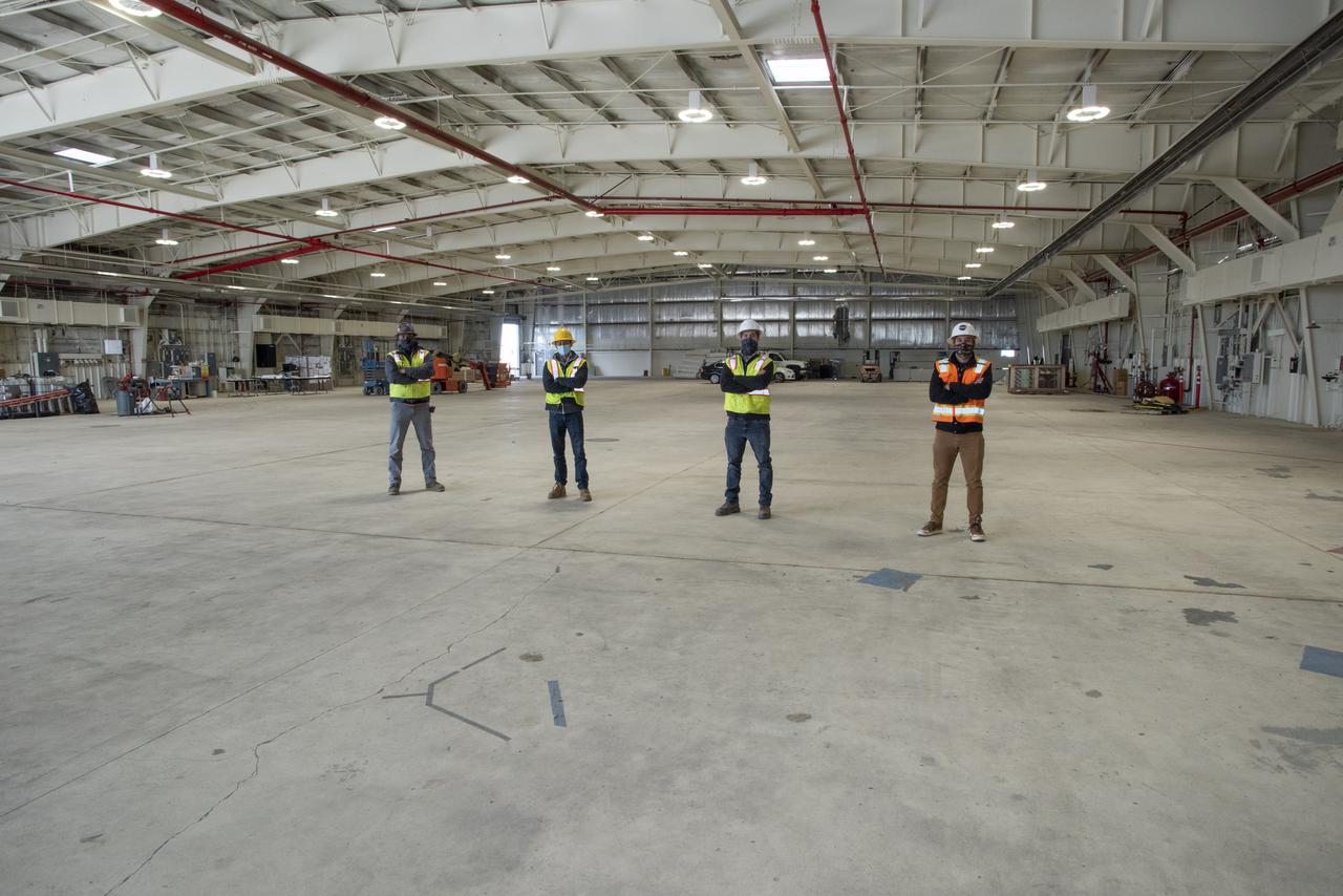 The future home of the X-59 Quiet SuperSonic Technology aircraft is taking shape at NASA's Armstrong Flight Research Center in Edwards, California. Some of the staff working on the project include from left to right Hector Mendoza, CJW/MZT Joint Venture site superintendent, Tim Nazer, CJW/MZT quality control manager, Collin Morris, CJW/MZT project manager and Bryan Watters, NASA civil/structural engineer and project manager.