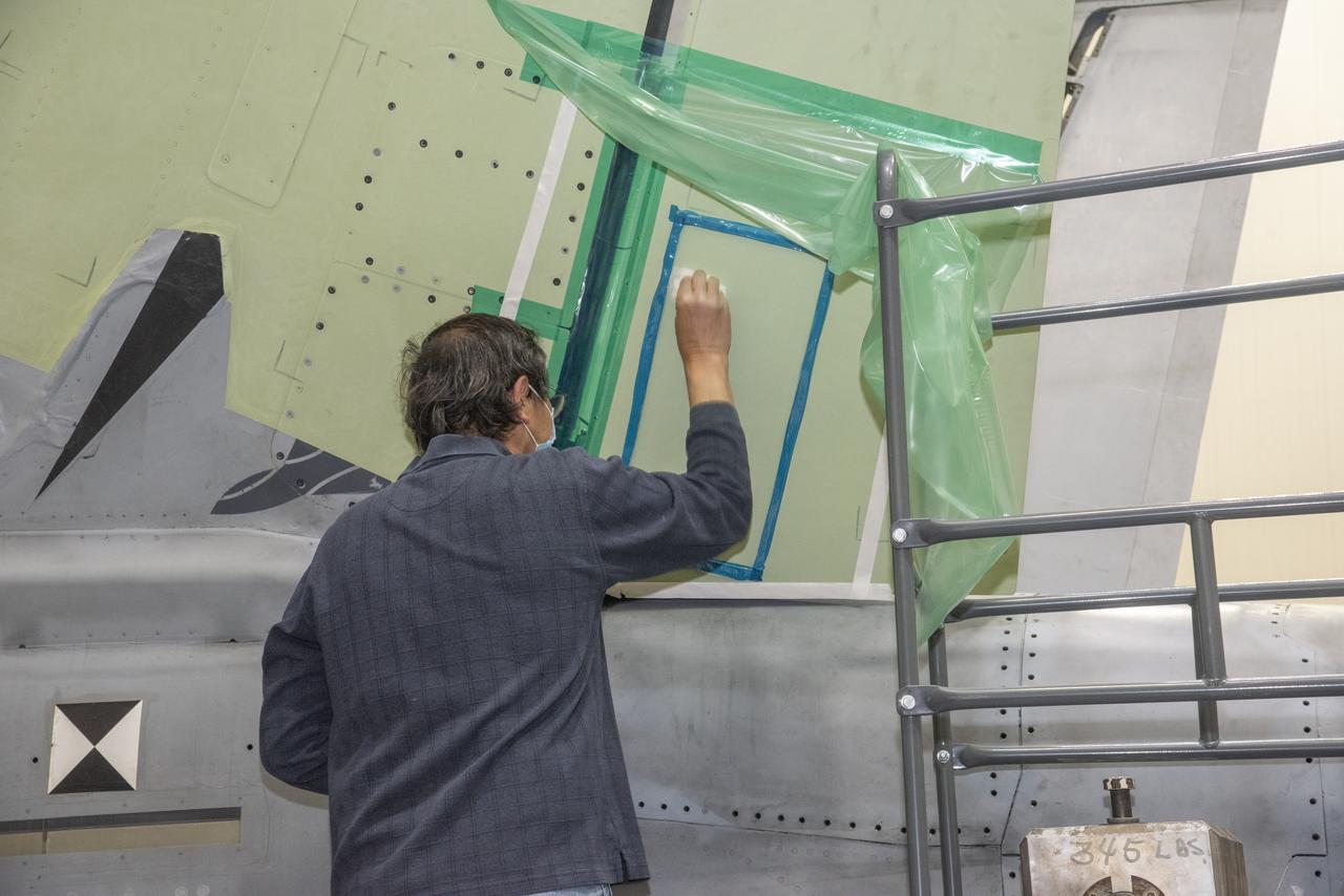 The load pad bonding process for the vertical tails was a preliminary step in the process to test the F/A-18E from the Naval Air Systems Command (NAVAIR) in Patuxent River, Maryland. The aircraft is in NASAâ€™s Armstrong Flight Research Center Flight Loads Laboratory in Edwards, California, for the centerâ€™s biggest load calibrations tests. This testing is needed before the aircraft can serve as a test vehicle for determining if it can safely manage maneuvers and proposed upgrades. 