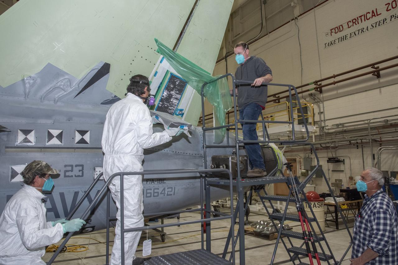 The load pad bonding process for the vertical tails was a preliminary step in the process to test the F/A-18E from the Naval Air Systems Command (NAVAIR) in Patuxent River, Maryland. The aircraft is in NASAâ€™s Armstrong Flight Research Center Flight Loads Laboratory in Edwards, California, for the centerâ€™s biggest load calibrations tests. This testing is needed before the aircraft can serve as a test vehicle for determining if it can safely manage maneuvers and proposed upgrades. 
