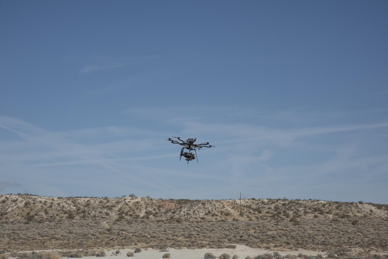 The Alta 8 remotely piloted aircraft flies above Rosamond North Lakebed at NASA's Armstrong Flight Research Center in Edwards, California. The Resilient Autonomy project used these flights to collect data with the Nav Module hardware and software developed by NASA's Jet Propulsion Laboratory in Pasadena, California.