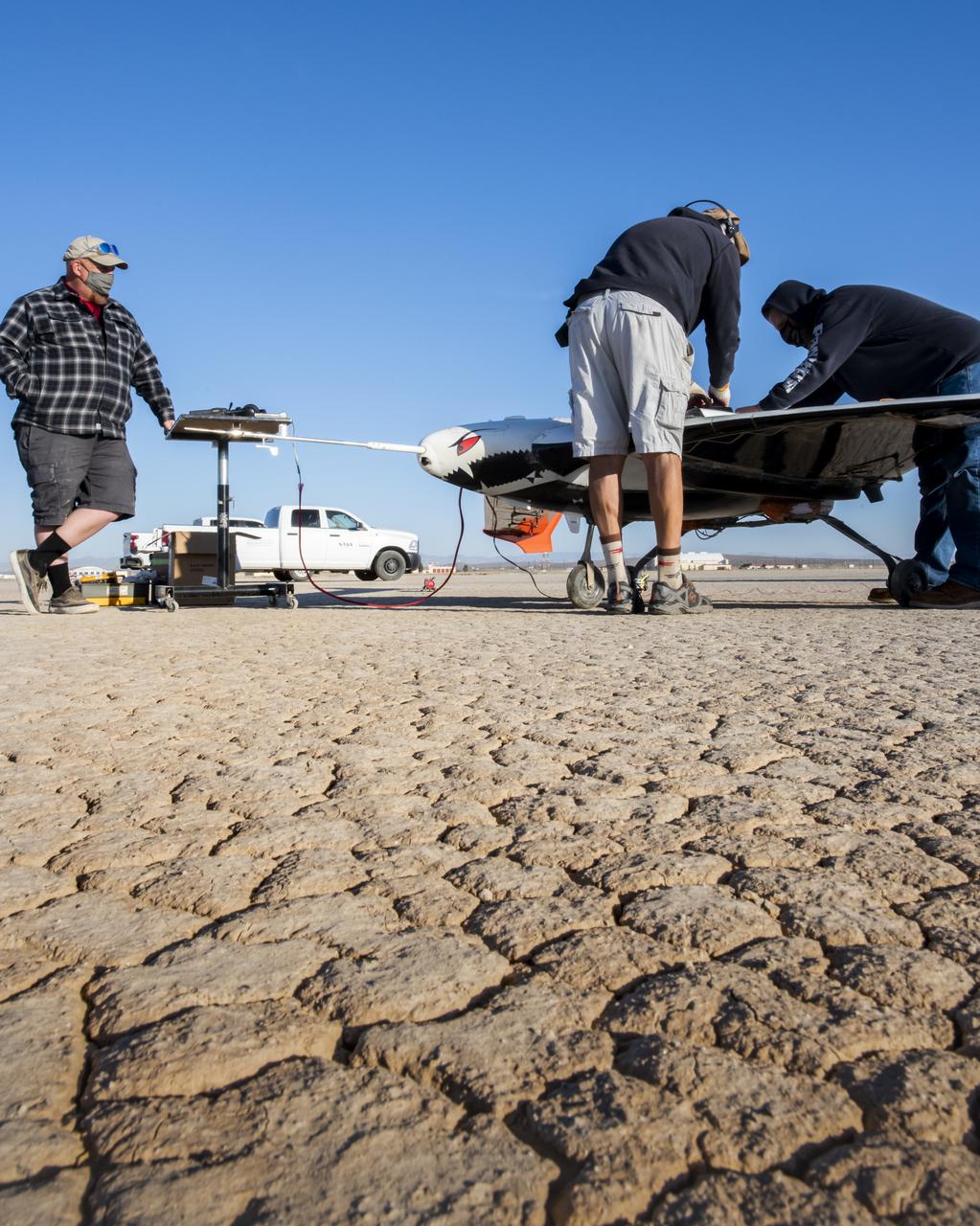 The X-56B remotely piloted aircraft ground crew prepares the aircraft to begin a new flight series. The flight was April 19 at NASA's Armstrong Flight Research Center in Edwards, California, with partner Northrop Grumman.