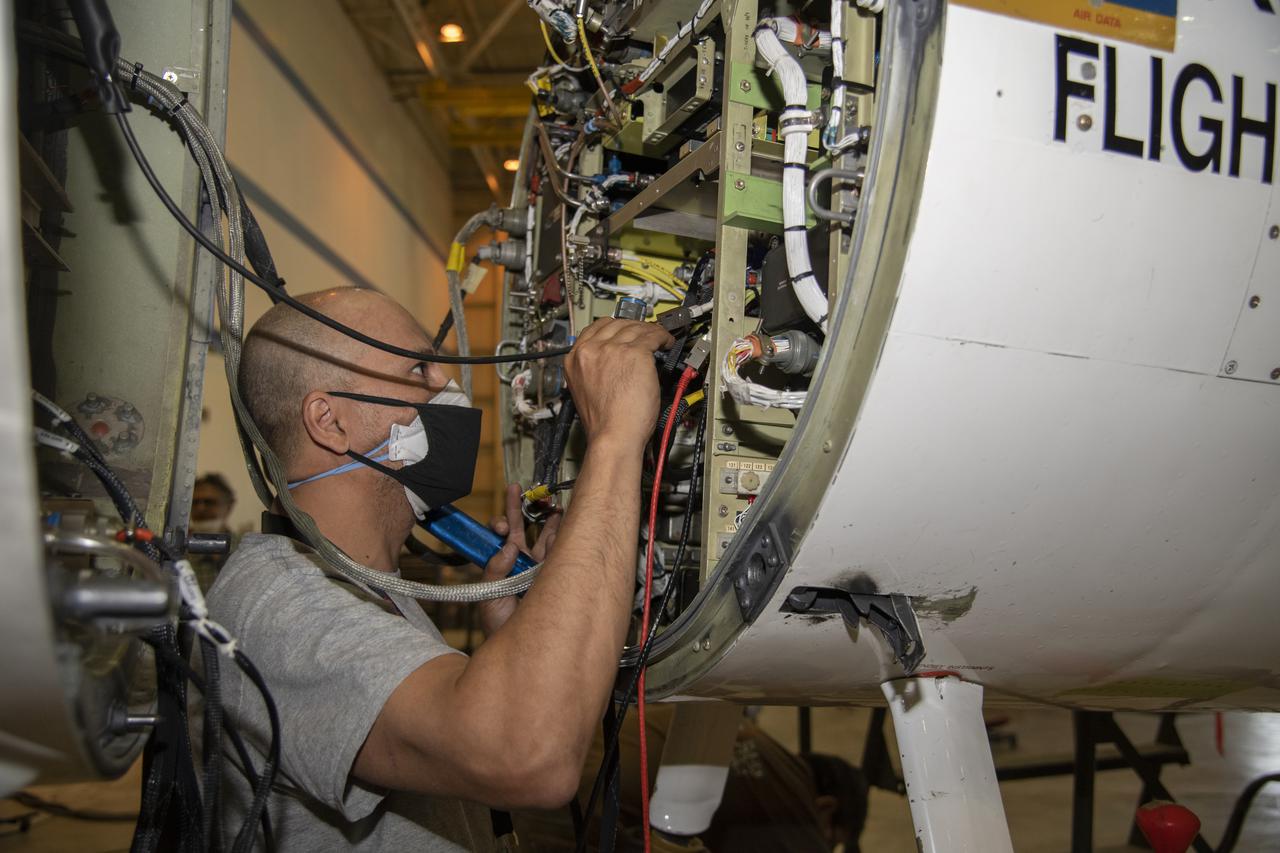NASA’s Armstrong Flight Research Center ER-2 #809 high-altitude aircraft maintained by avionics technician Gregory Bantalin for Dynamics and Chemistry of the Summer Stratosphere (DCOTSS) science flights. 