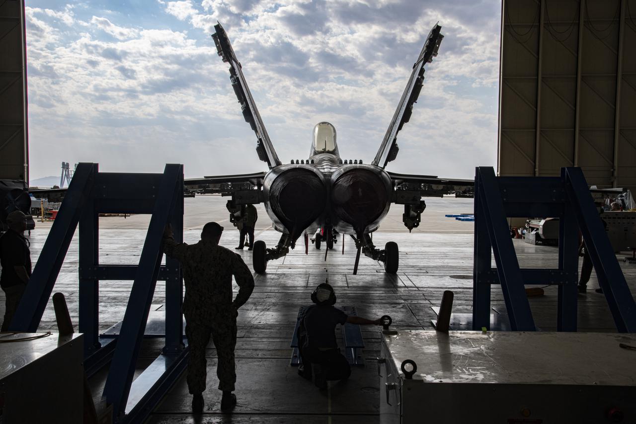 The Naval Air Systems Command (NAVAIR) in Patuxent River, Maryland F/A-18E is moved to NASAâ€™s Armstrong Flight Research Center Flight Loads Laboratory in Edwards, California. NASA Armstrong is working on its biggest load calibrations tests on an F/A-18E Super Hornet. This testing is needed before the aircraft can serve as a test vehicle for determining if it can safely manage maneuvers and proposed upgrades. 