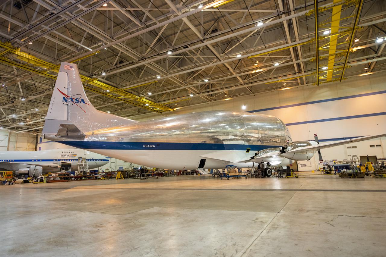 NASA's Super Guppy Turbine cargo aircraft in the hangar at NASA's Armstrong Flight Research Center on August 24, 2021. This unique whale-like aircraft arrived at the center's Building 703 in Palmdale, CA to support crews in the performance of routine maintenance. The Super Guppy aircraft, operated by NASA's Johnson Space Center, aids in the transportation of oversized aerospace cargo in a practical and economical way.