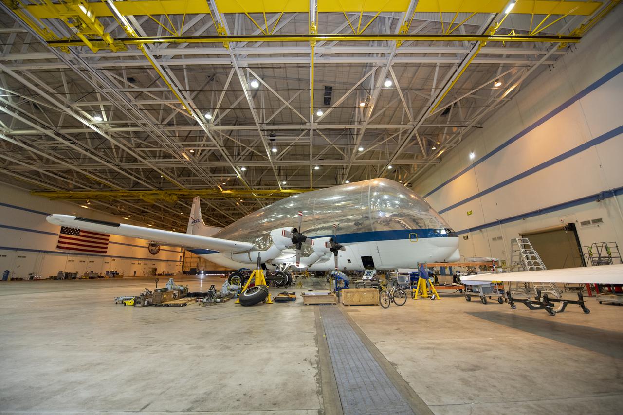 NASA's Super Guppy Turbine cargo aircraft in the hangar at NASA's Armstrong Flight Research Center on August 24, 2021. This unique whale-like aircraft arrived at the center's Building 703 in Palmdale, CA to support crews in the performance of routine maintenance. The Super Guppy aircraft, operated by NASA's Johnson Space Center, aids in the transportation of oversized aerospace cargo in a practical and economical way.