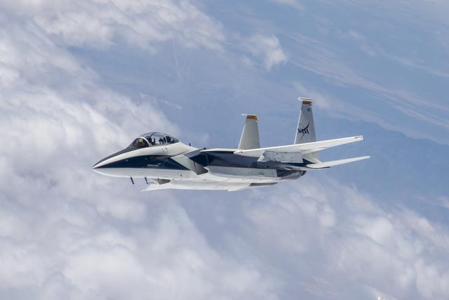NASA image: F-15 N897NA inflight during Shock Sensing Probe (SSP) Flight #1 with test pilot Jim Less and videographer Lori Losey on board