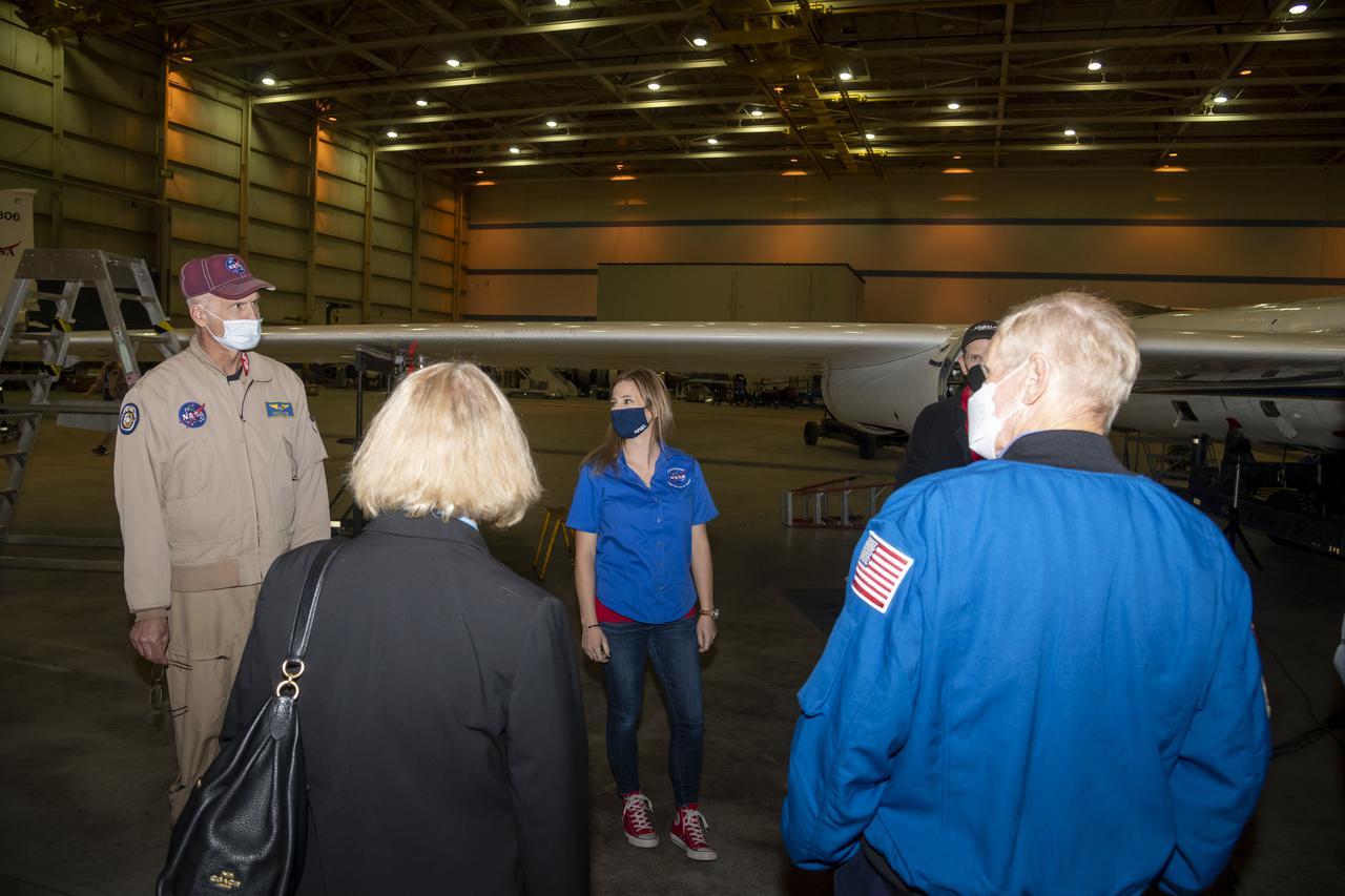 NASA Administrator Bill Nelson and NASA Deputy Administrator Pam Melroy receive a briefing on the high-altitude ER-2 aircraft and its missions from ER-2 pilot Greg "Coach" Nelson and ER-2 deputy project manager Fran Becker, and ER-2 pilot Tim Williams at Building 703 in Palmdale, California. The building is part of NASA's Armstrong Flight Research Center, which has its main campus in Edwards, California.