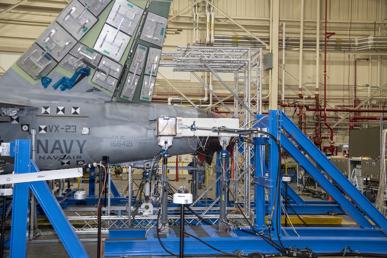 The horizontal tail is under test load on a F/A-18E from the Naval Air Systems Command (NAVAIR) in Patuxent River, Maryland. The aircraft is in NASAâ€™s Armstrong Flight Research Center Flight Loads Laboratory in Edwards, California, for the centerâ€™s biggest load calibrations tests. This testing is needed before the aircraft can serve as a test vehicle for determining if it can safely manage maneuvers and proposed upgrades.