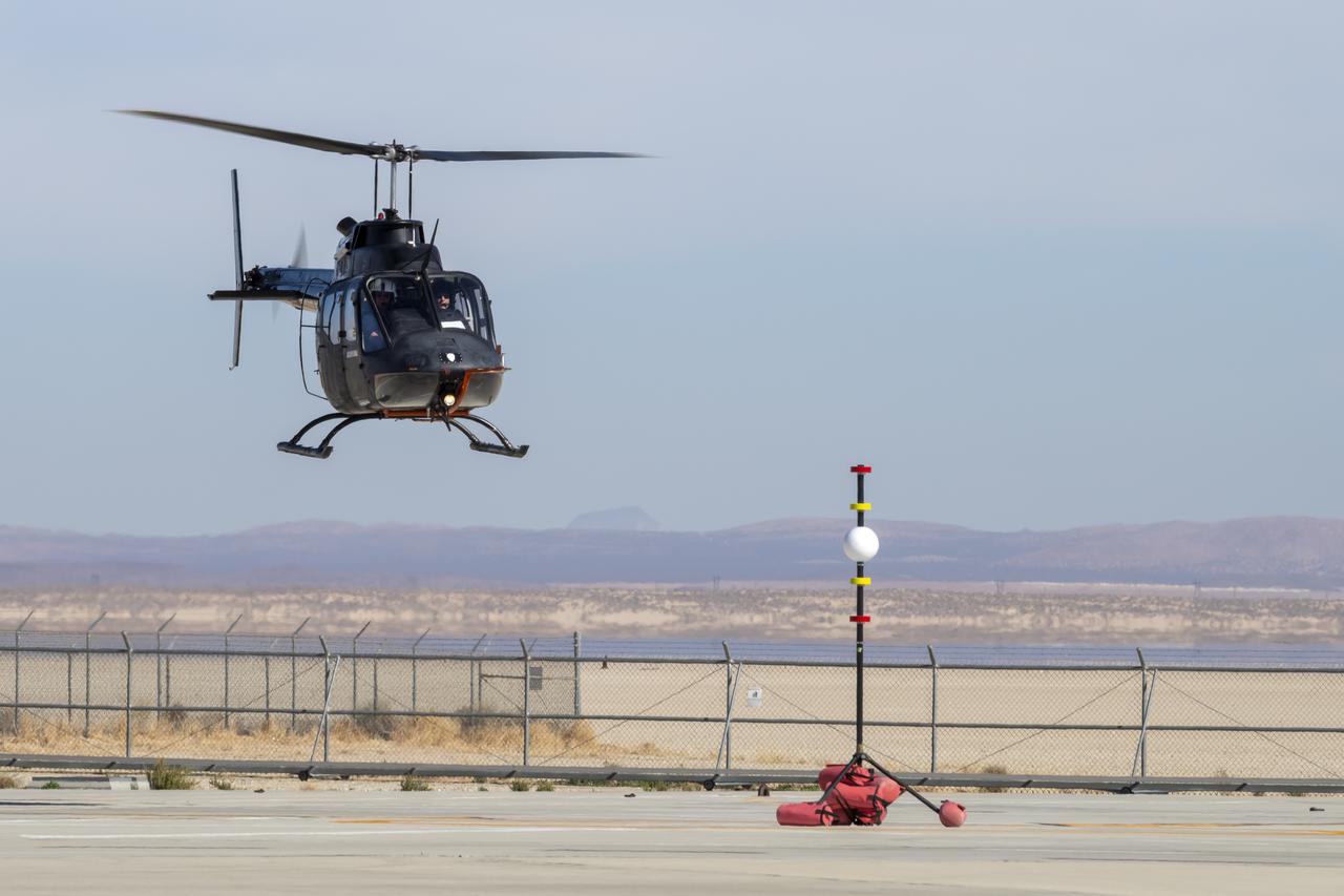 NASA's Advanced Air Mobility National Campaign created a visual aid, known as a tetherball, to serve as the helicopter pilot's height reference while flying different task elements at NASA's Armstrong Flight Research Center in Edwards, California, Nov. 8-10. The Bell OH-58 Kiowa helicopter provided by Flight Research Inc. was used to study urban air mobility vehicle performance and flying qualities requirements.