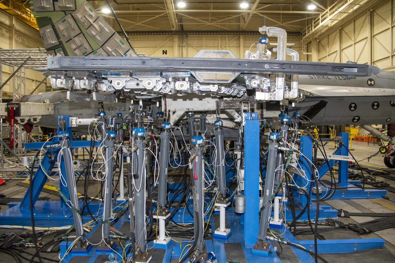 NASA’s Armstrong Flight Research Center Flight Loads Laboratory in Edwards, California, is working on one of its biggest load calibrations tests on an F/A-18E Super Hornet from the Naval Air Systems Command (NAVAIR) in Patuxent River, Maryland. This testing is needed before the aircraft can serve as a test vehicle for determining if it can safely manage maneuvers and proposed upgrades. The horizontal tail spindle testing, the first of three phases, wrapped up in October 2021. The next phase focuses on wing loads testing that is set to begin in December 2021.