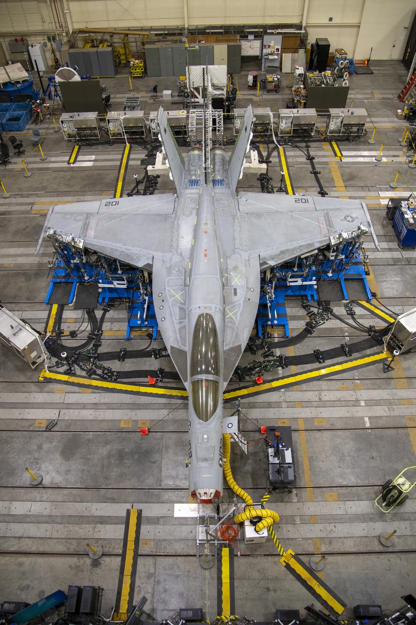 NASA’s Armstrong Flight Research Center Flight Loads Laboratory in Edwards, California, is working on one of its biggest load calibrations tests on an F/A-18E Super Hornet from the Naval Air Systems Command (NAVAIR) in Patuxent River, Maryland. This testing is needed before the aircraft can serve as a test vehicle for determining if it can safely manage maneuvers and proposed upgrades. This is a view of the test setup for the wing loads testing that is set to begin in December 2021.