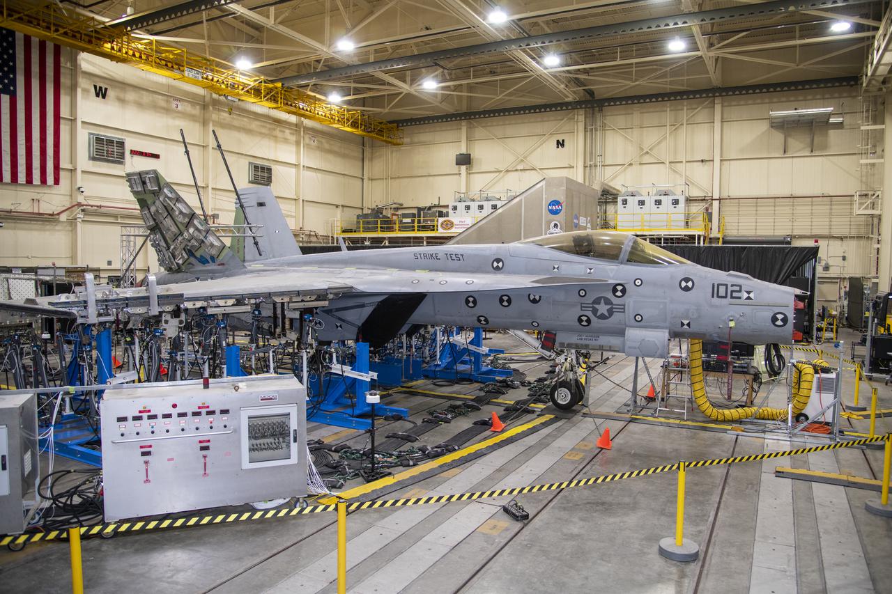NASA’s Armstrong Flight Research Center Flight Loads Laboratory in Edwards, California, is working on one of its biggest load calibrations tests on an F/A-18E Super Hornet from the Naval Air Systems Command (NAVAIR) in Patuxent River, Maryland. This testing is needed before the aircraft can serve as a test vehicle for determining if it can safely manage maneuvers and proposed upgrades. This is a view of the test setup for the wing loads testing that is set to begin in December 2021.